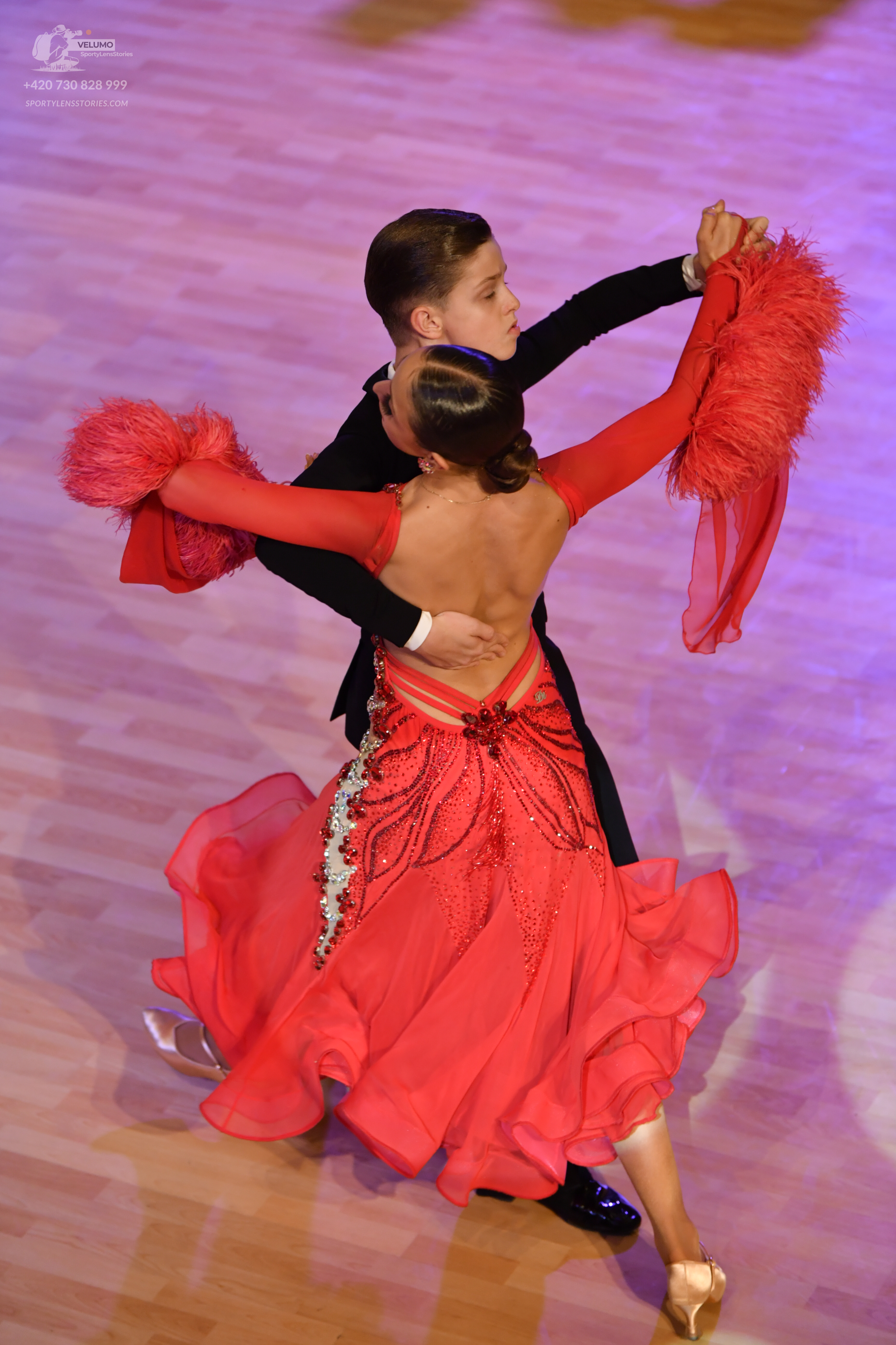 Dancesport competitor: Male:** Black tail suit with a slightly flared bottom