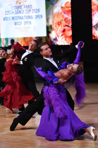 Dancesport competitor: Male dancer: black suit, white shirt, and black bowtie