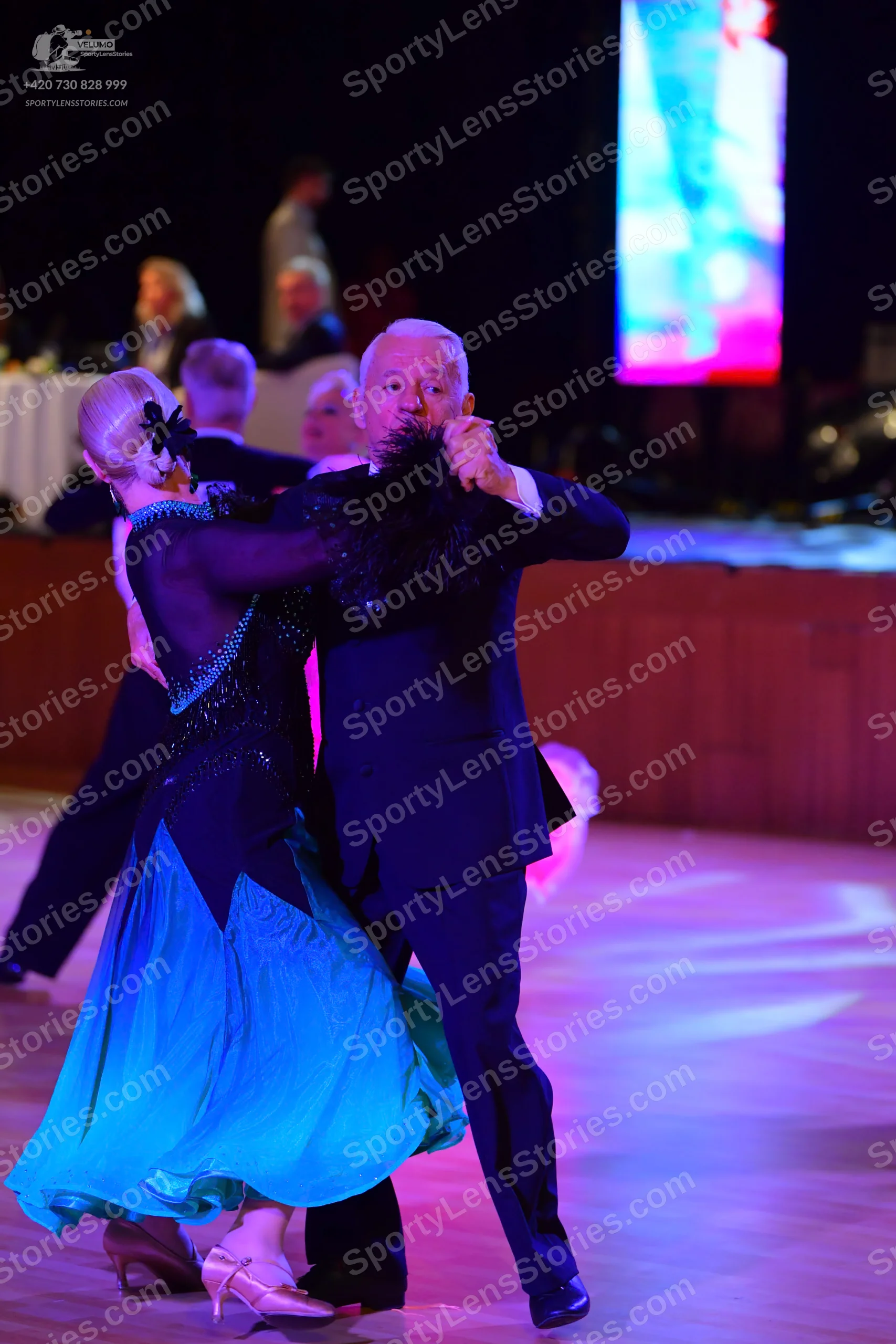 Dancesport competitor: Male**
*   **Color:** Black
*   **Fabric:** Likely satin or a similar smooth fab