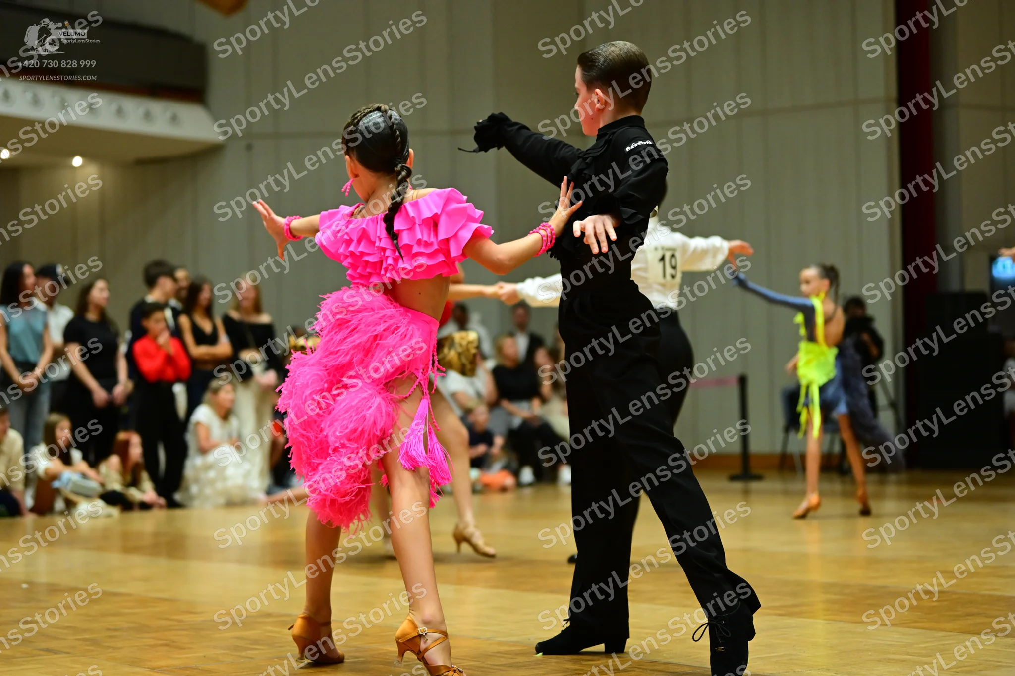 Dancesport competitor #19: Female dancer 1: pink ruffled Latin dress