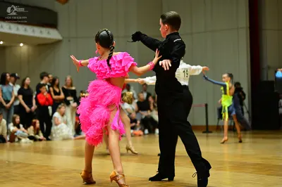 Dancesport competitor #19: Female dancer 1: pink ruffled Latin dress