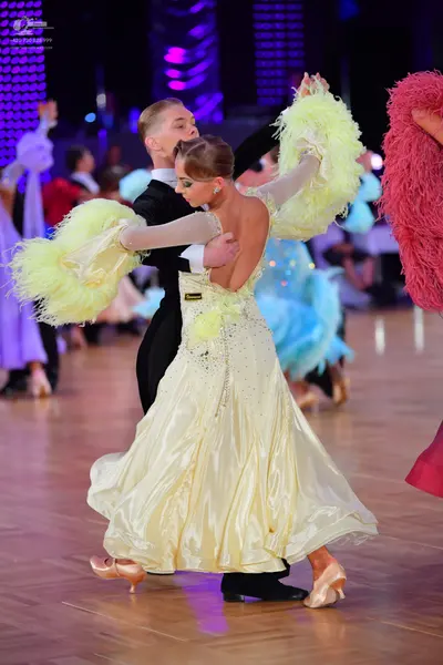Dancesport competitor: Male dancer: black ballroom suit with a white shirt and black bowtie