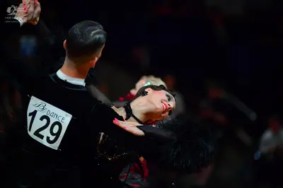 Dancesport competitor #129: Male dancer: black long-sleeved shirt