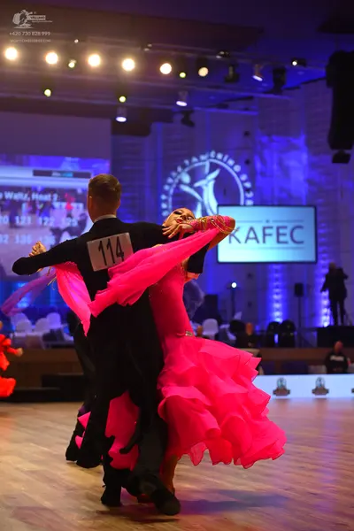 Dancesport competitor: Male dancer: black suit