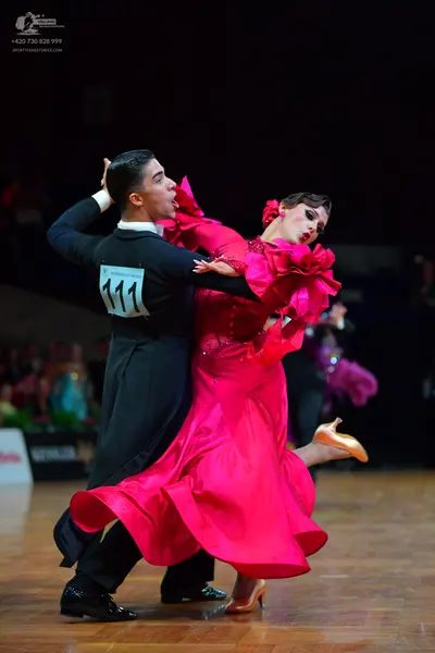 Dancesport competitor #111: Male dancer: black long-sleeved shirt and black trousers with black dance shoes