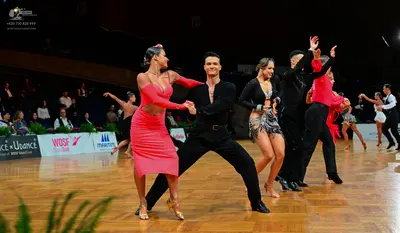 Dancesport competitor: Male dancer: black long-sleeved shirt and black trousers
