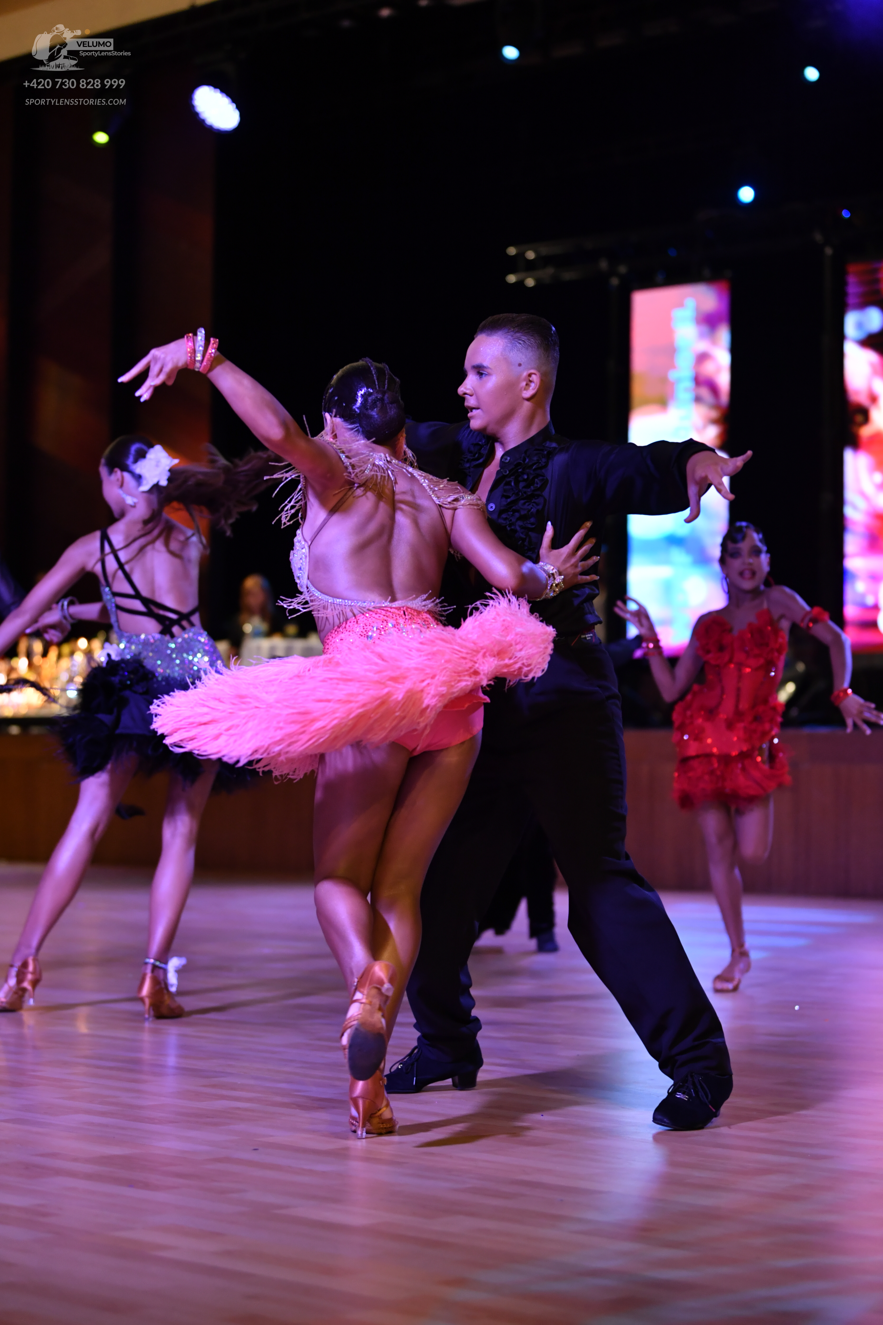 Dancesport competitor: ** Black suit with a wide, sequined lapel