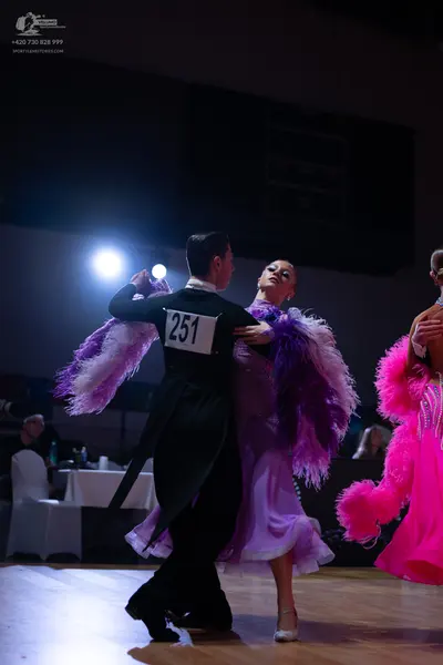 Dancesport competitor: Male dancer: black tailcoat suit