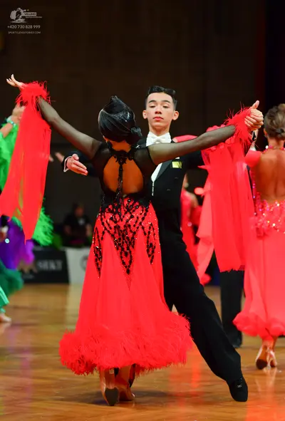 Dancesport competitor: Male dancer: black suit with white shirt and white bow tie