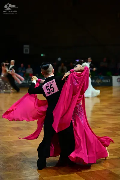 Dancesport competitor #55: Male dancer: black long-sleeved shirt and black trousers