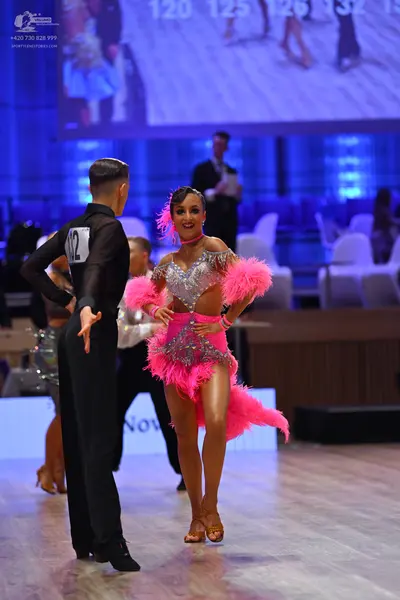 Dancesport competitor: Male dancer: black long-sleeved shirt and black trousers