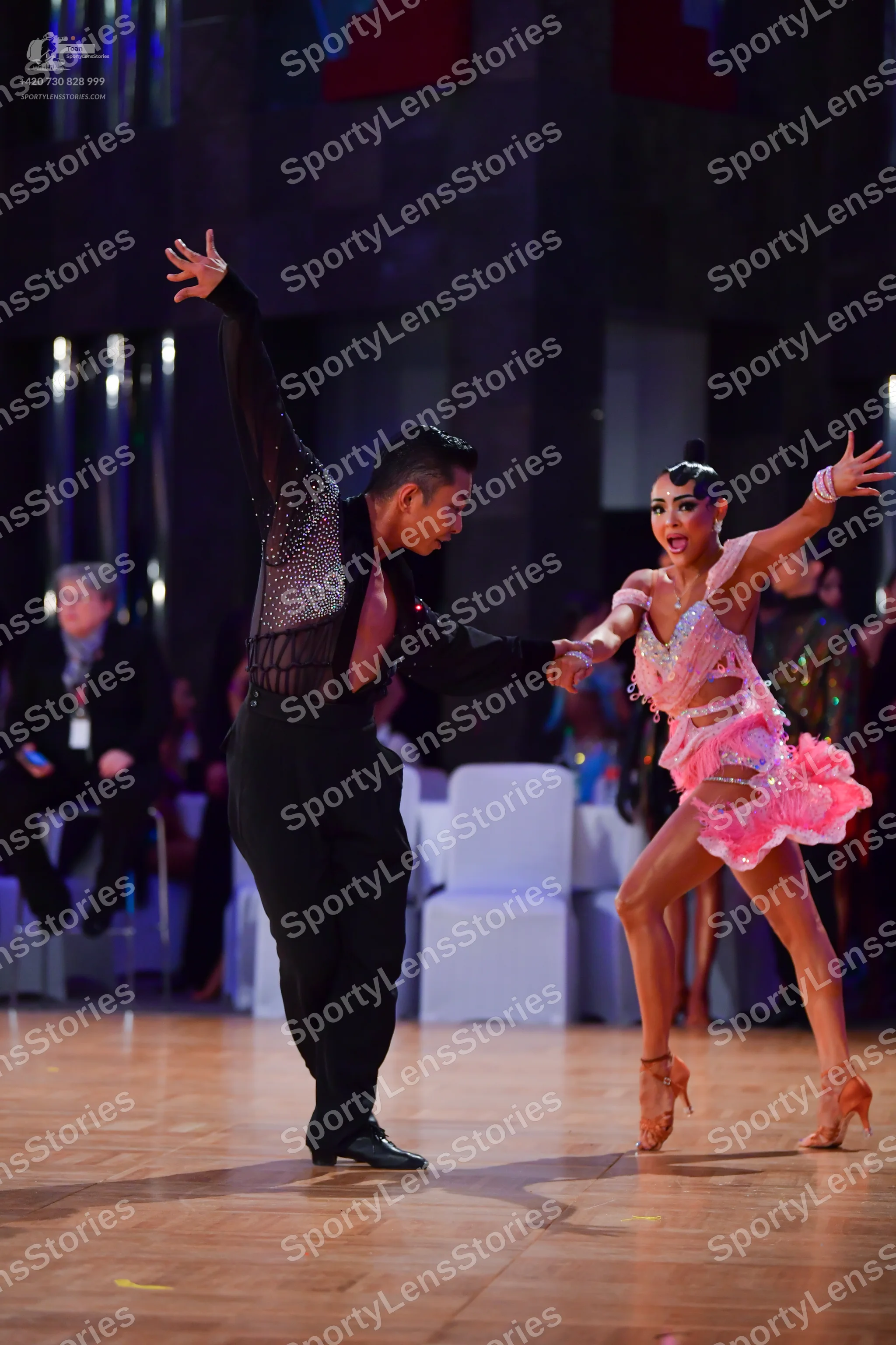 Dancesport competitor: Male dancer: black long-sleeved Latin dance shirt with sequins on the upper part