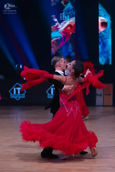 Dancesport competitor: Male dancer: black suit with white shirt