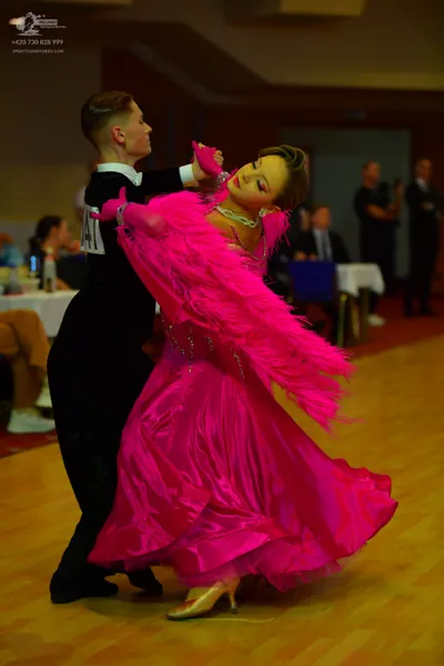 Dancesport competitor: ** Black tail suit
