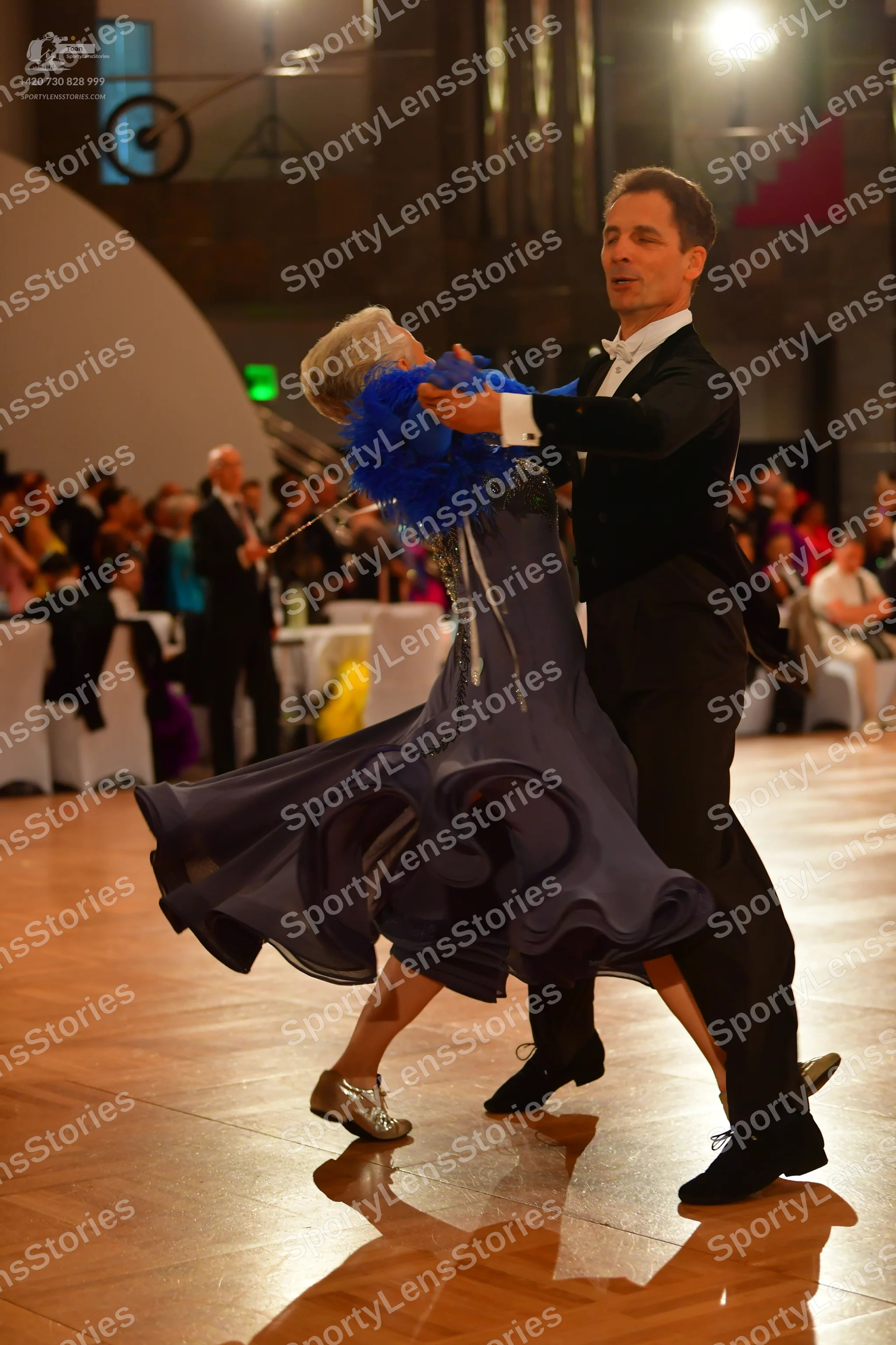 Dancesport competitor: Male dancer: black suit with a white shirt and white bowtie