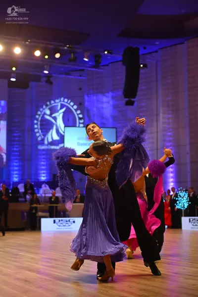 Dancesport competitor: Male dancer: black suit
