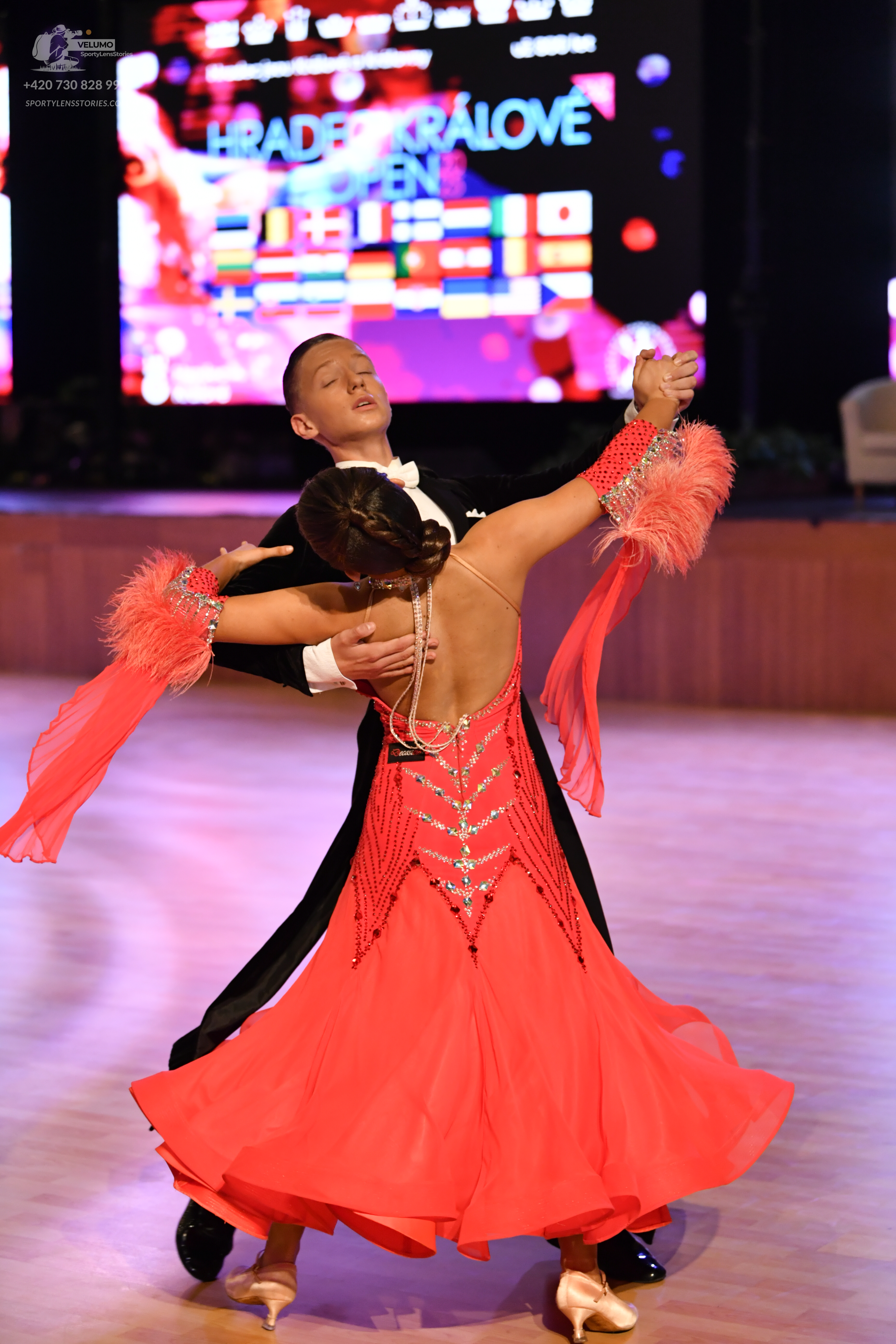 Dancesport competitor: ** Black ballroom suit