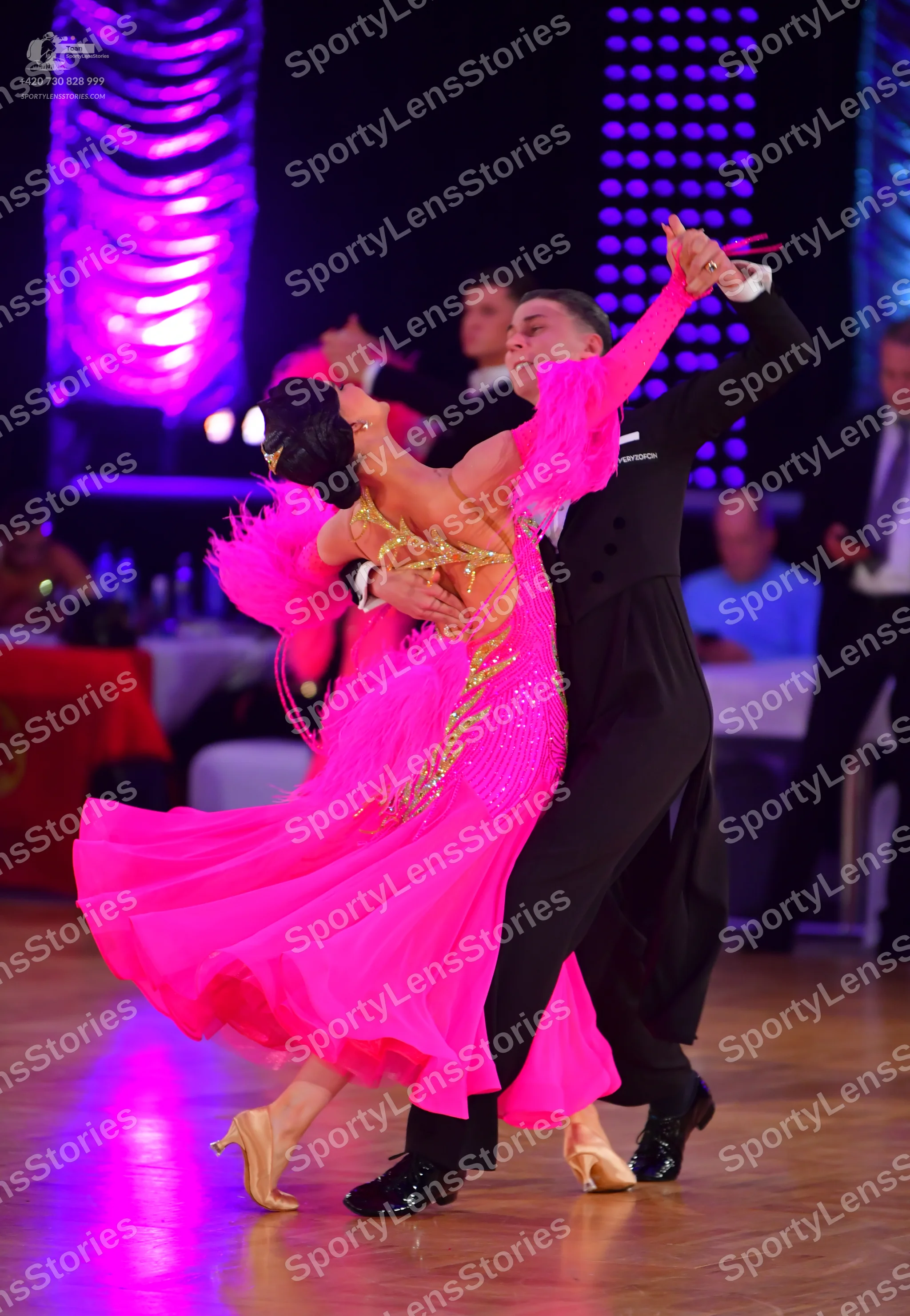 Dancesport competitor: Male dancer: black ballroom suit with black trousers and black dance shoes