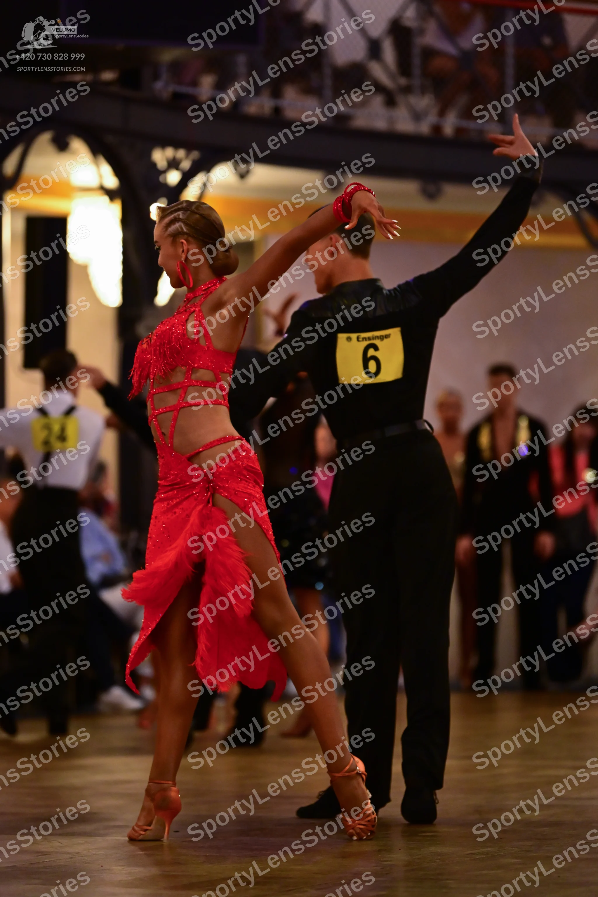 Dancesport competitor: Female dancer: red latin dress with cut-outs