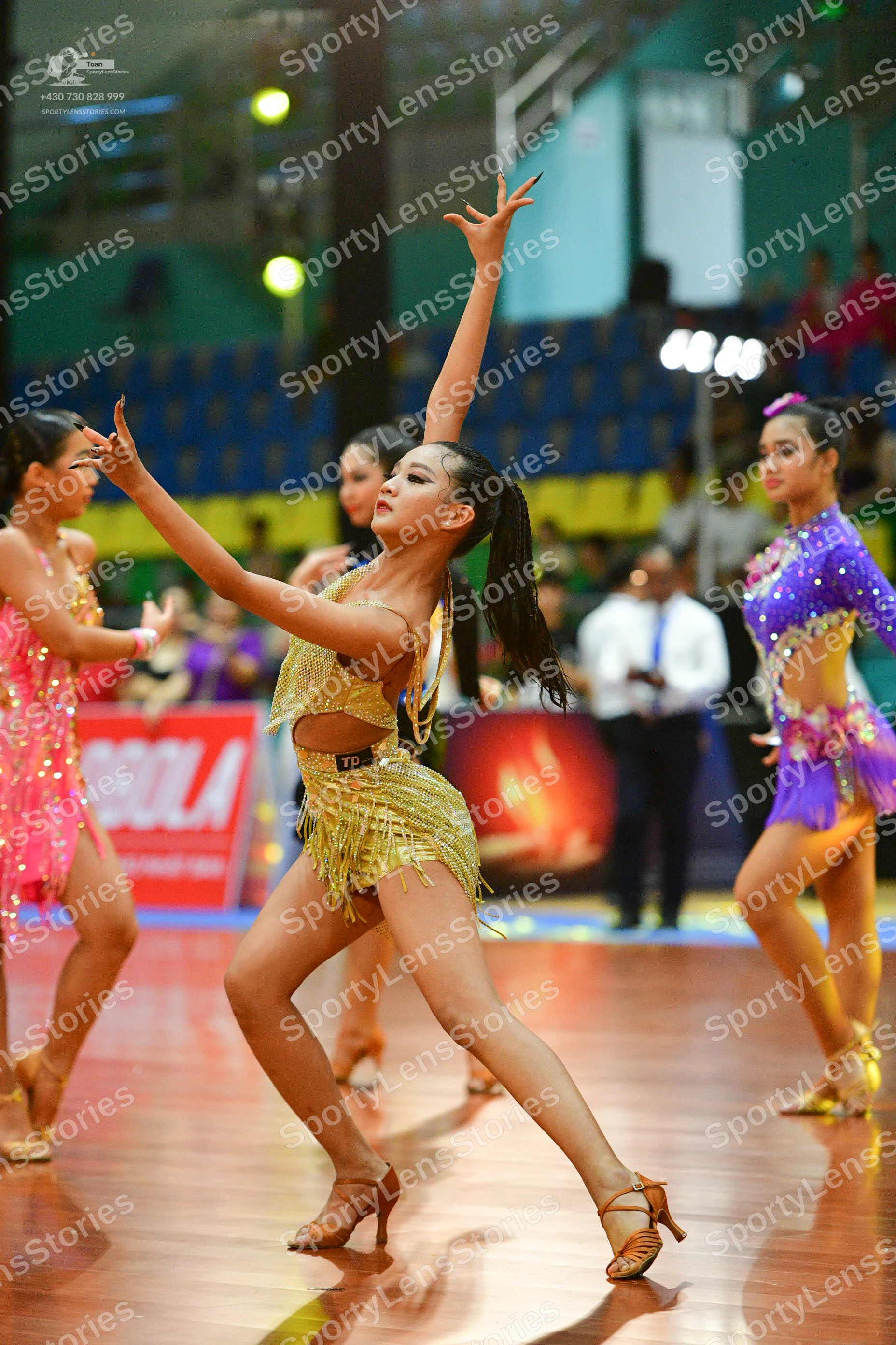 Dancesport competitor: Male**
*   **Color:** Black
*   **Fabric:** Primarily sequins, with what appears