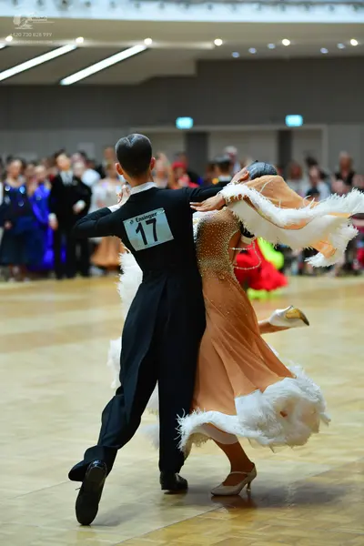 Dancesport competitor #17: Male dancer: black long-sleeved shirt and black trousers