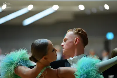 Dancesport competitor: Male dancer: black suit with white shirt