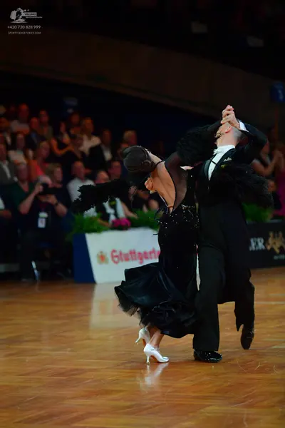 Dancesport competitor: Male dancer: black suit