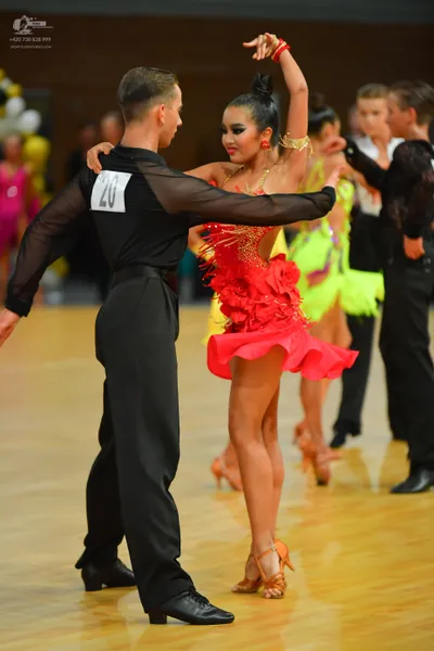 Dancesport competitor: ** Black tailsuit with sequin lapels