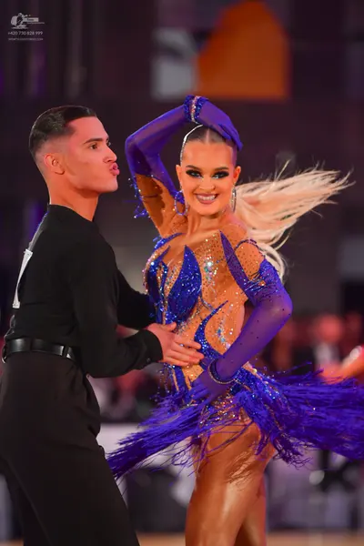 Dancesport competitor: Male dancer: black long-sleeved shirt and black trousers