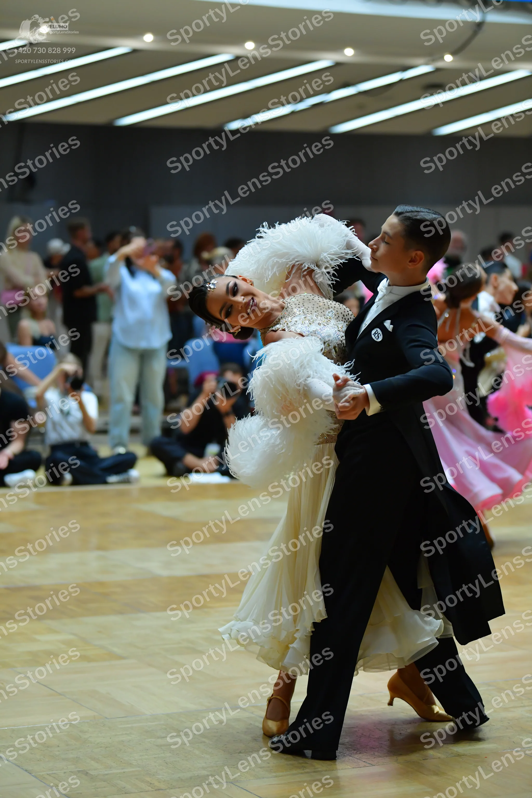 Dancesport competitor: Male dancer: black tailcoat-style suit with black trousers and a white shirt