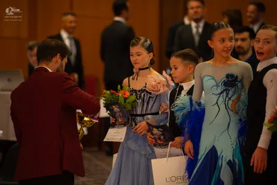 Dancesport competitor: Male dancer: maroon/burgundy suit jacket