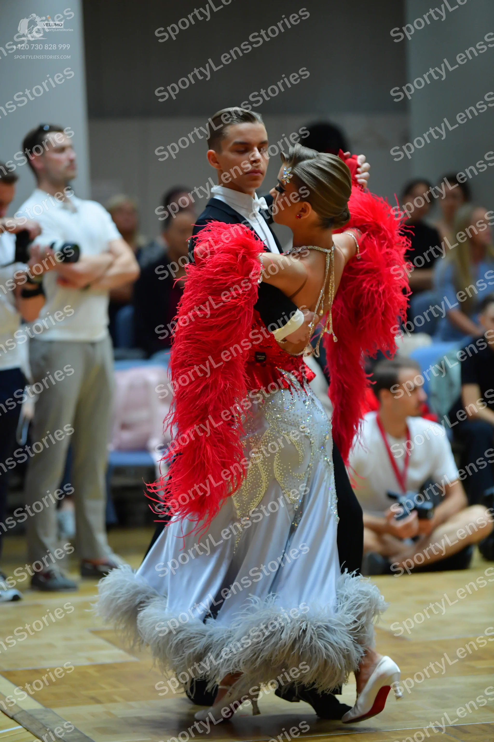 Dancesport competitor: Male dancer: black ballroom suit with a white shirt and white bow tie