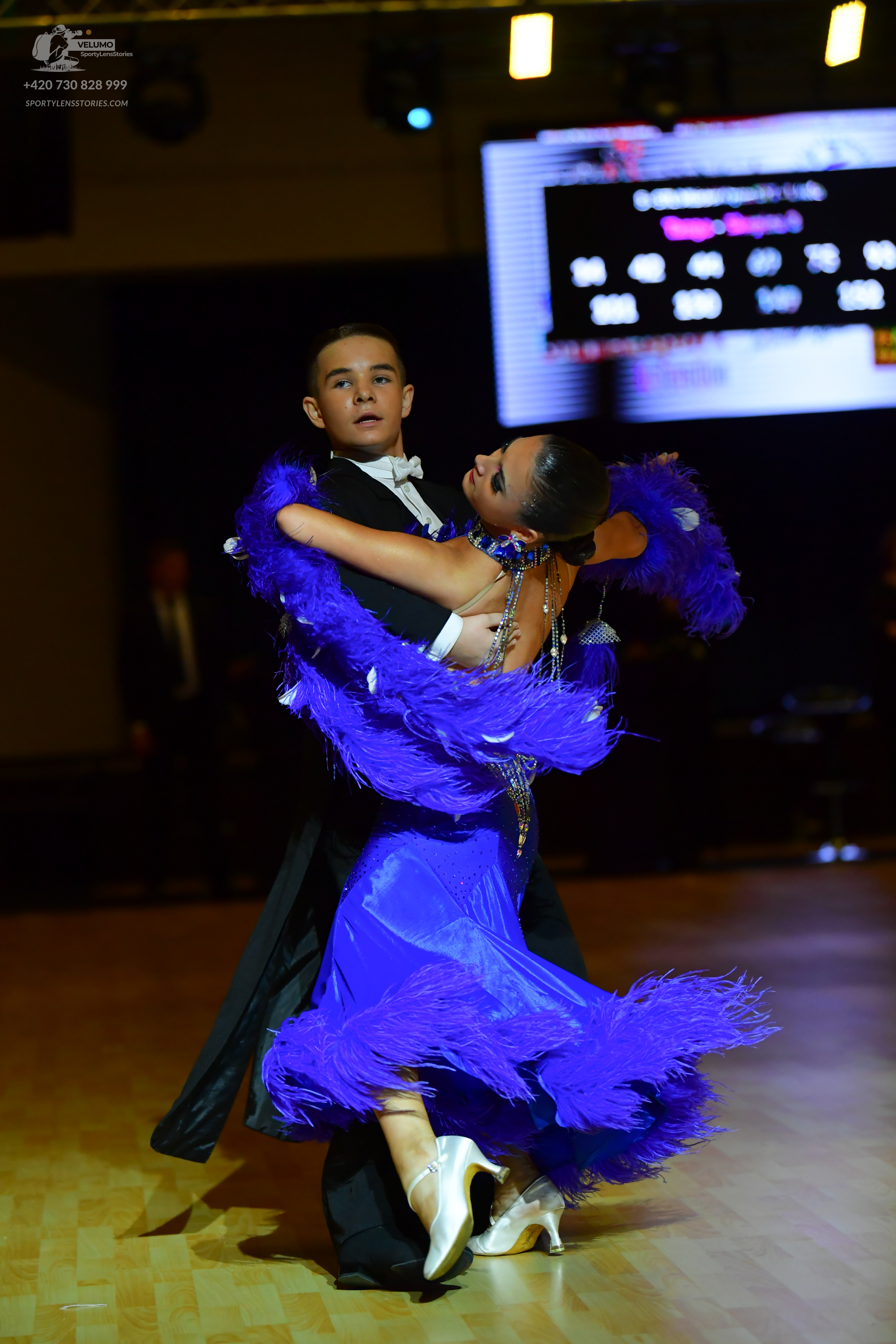 Dancesport competitor: Male dancer: black suit with a white shirt and white bowtie