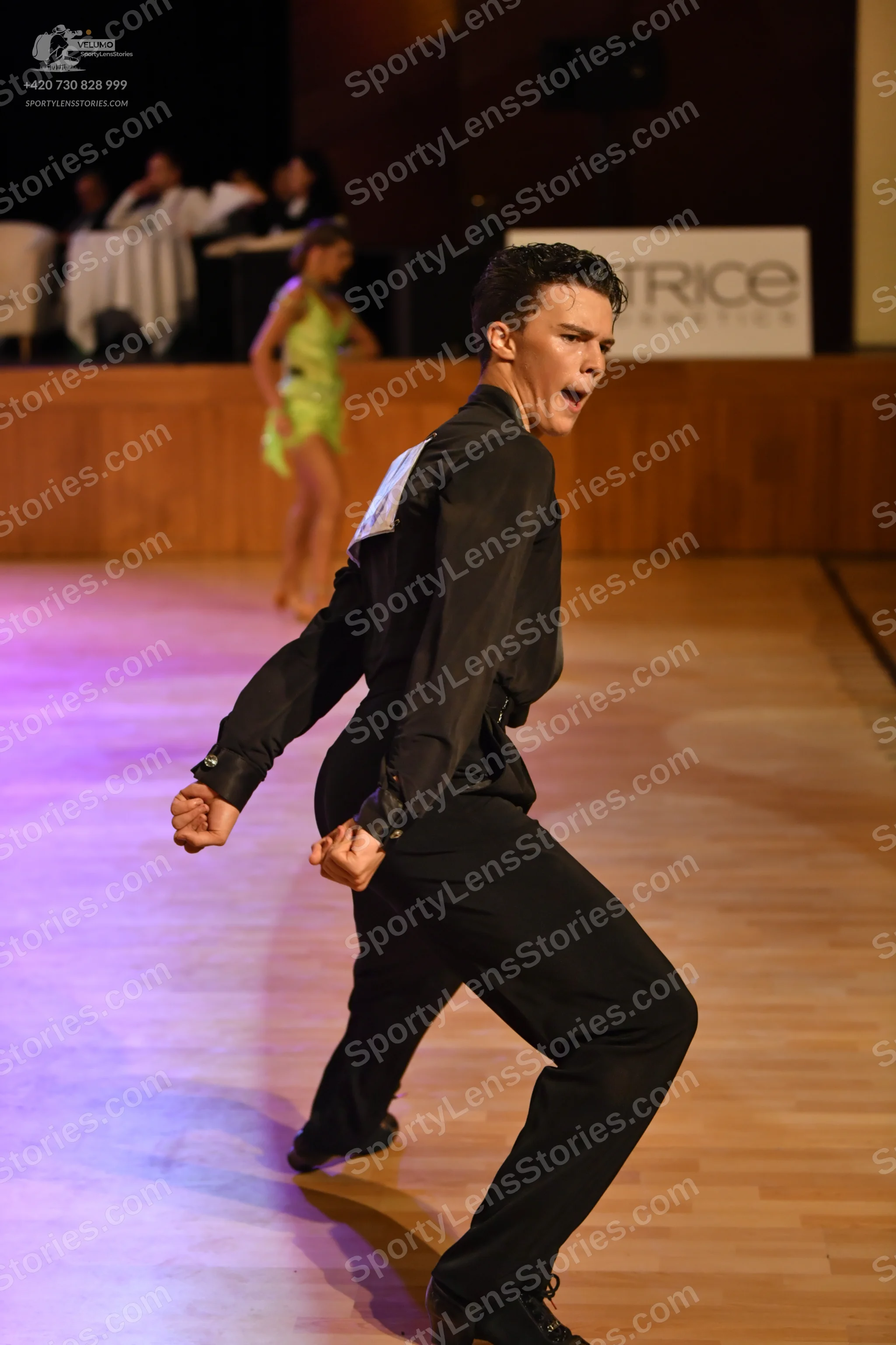 Dancesport competitor: Male dancer: black long-sleeve shirt and black trousers