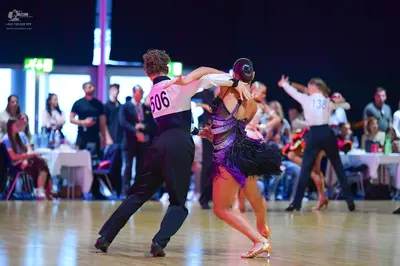 Dancesport competitor #506, #138: Male dancer (506): white long-sleeved shirt and black trousers