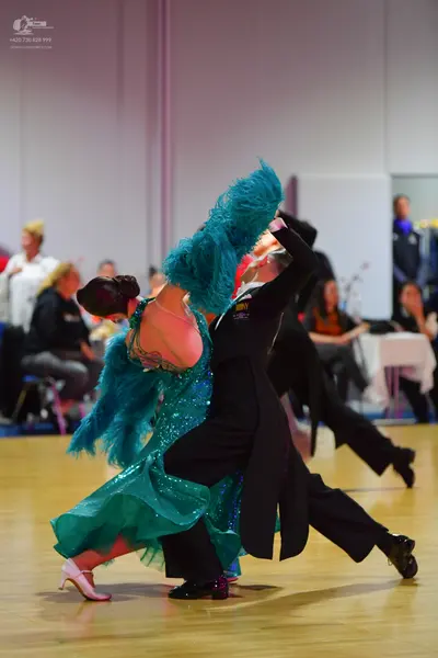 Dancesport competitor: Male dancer: black suit and black shoes