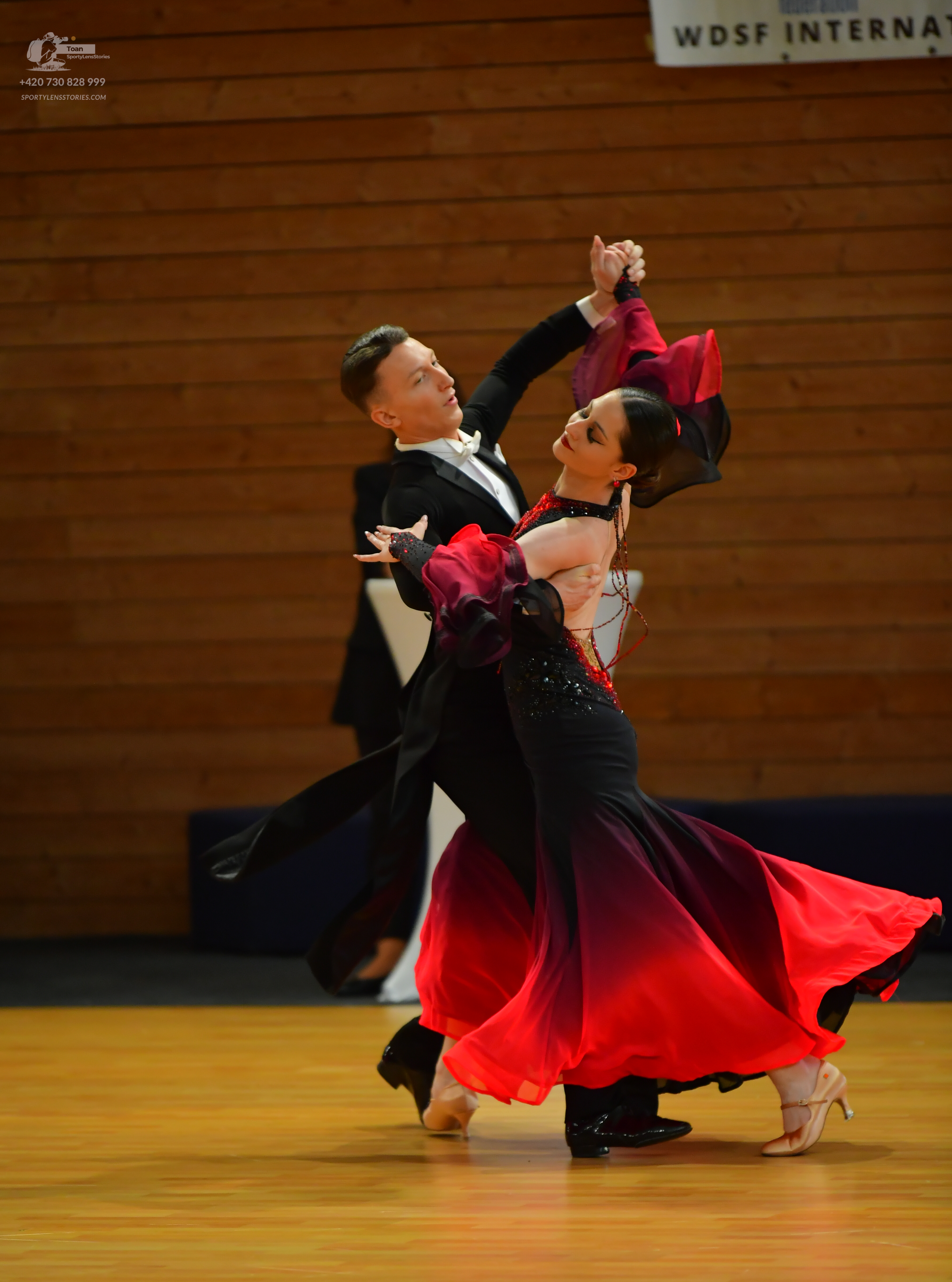 Dancesport competitor: Male:** Black tailsuit with sequin lapels