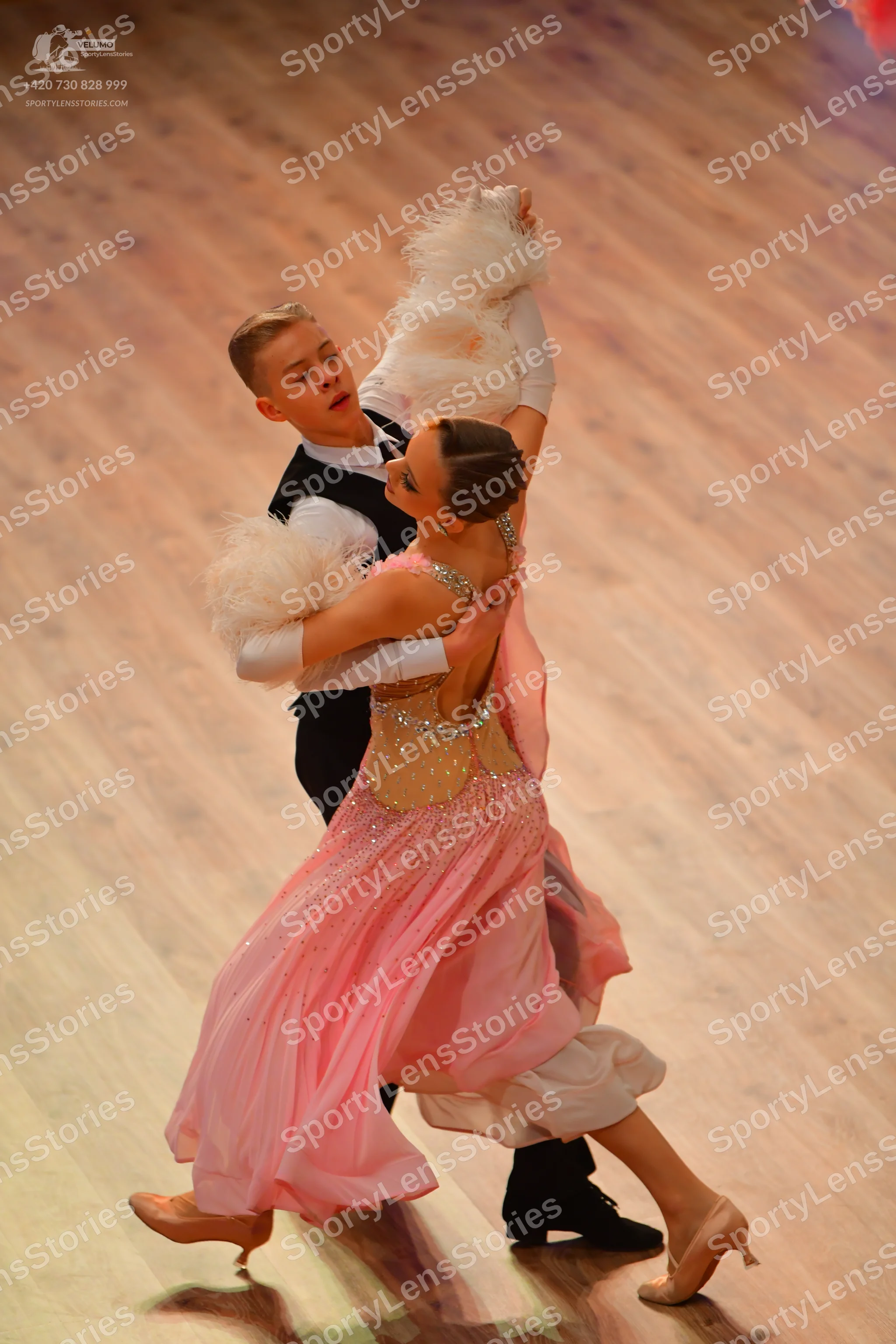 Dancesport competitor: Male dancer: black waistcoat over a white long-sleeved shirt and black trousers