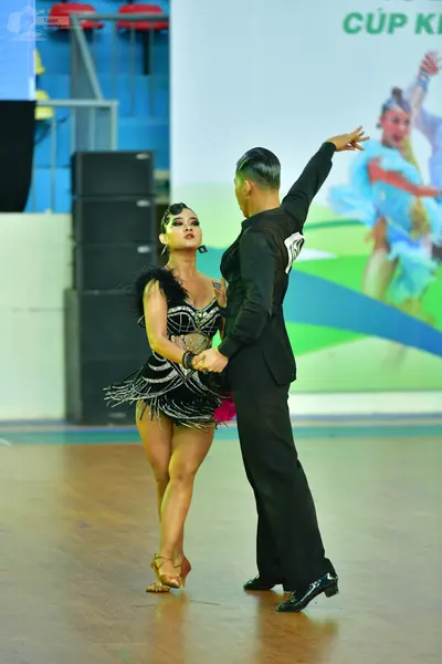 Dancesport competitor: ** Black suit with a high collar