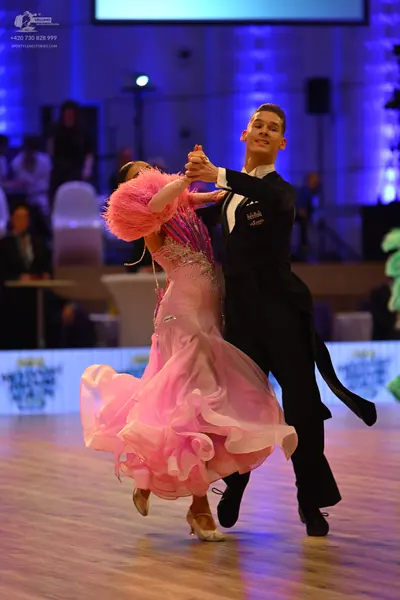 Dancesport competitor: Male dancer: black ballroom tailcoat suit with a white shirt