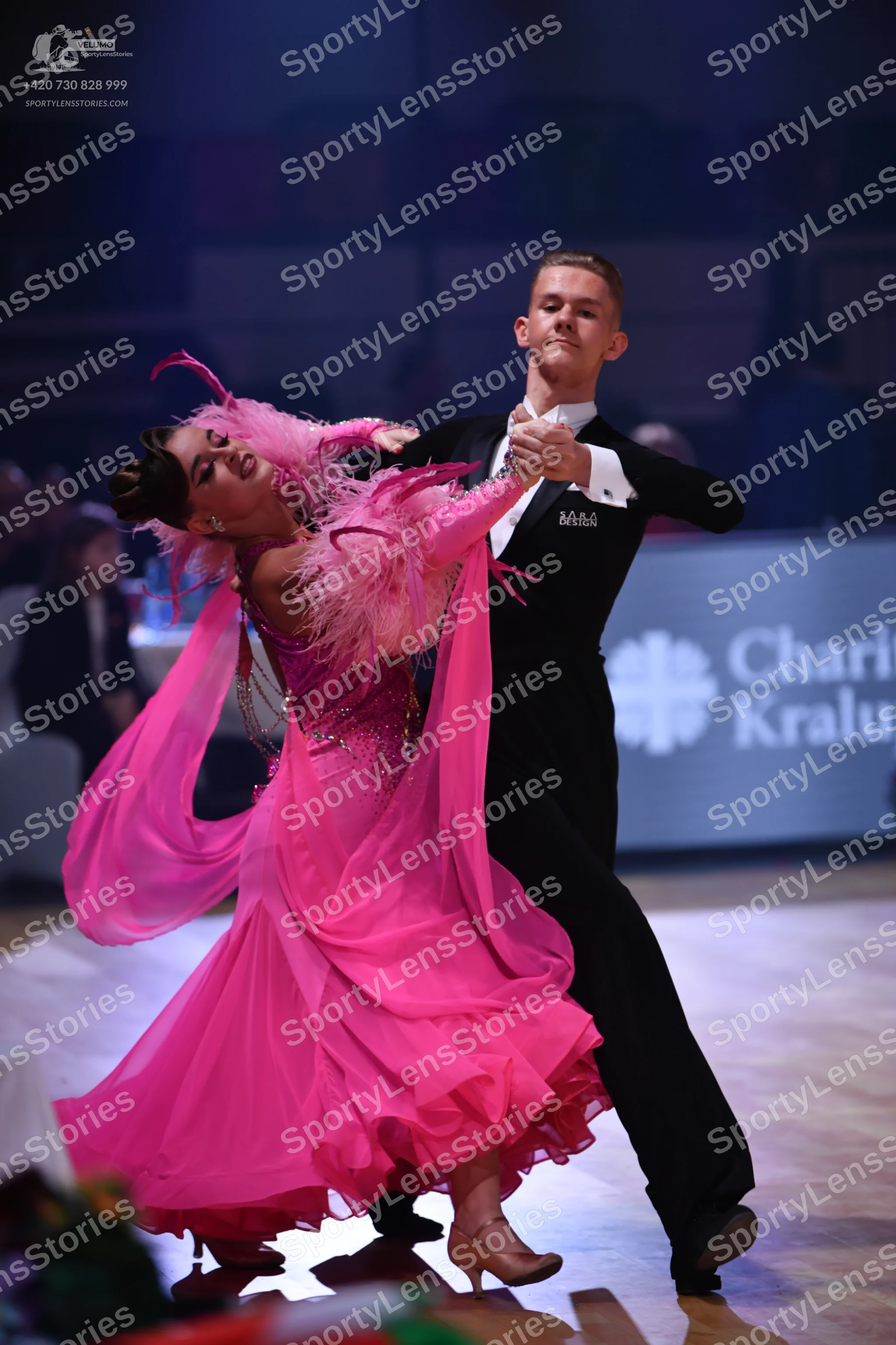Dancesport competitor: Male dancer: black suit with a white shirt and black bowtie