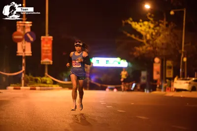Marathon runner #42134: Runner 1: blue tank top, blue shorts, white visor, white shoes