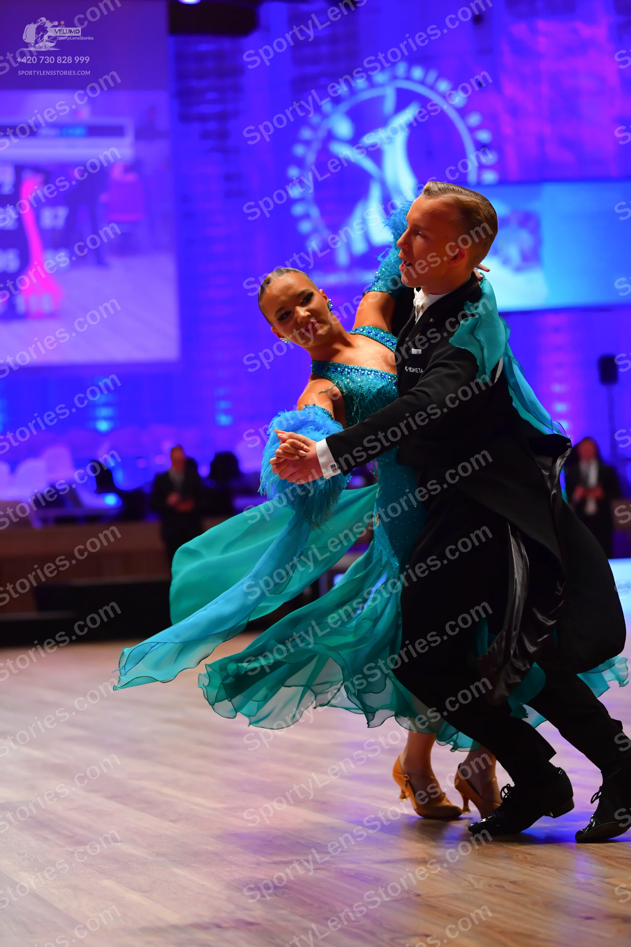 Dancesport competitor: Male dancer: black formal suit with a white shirt