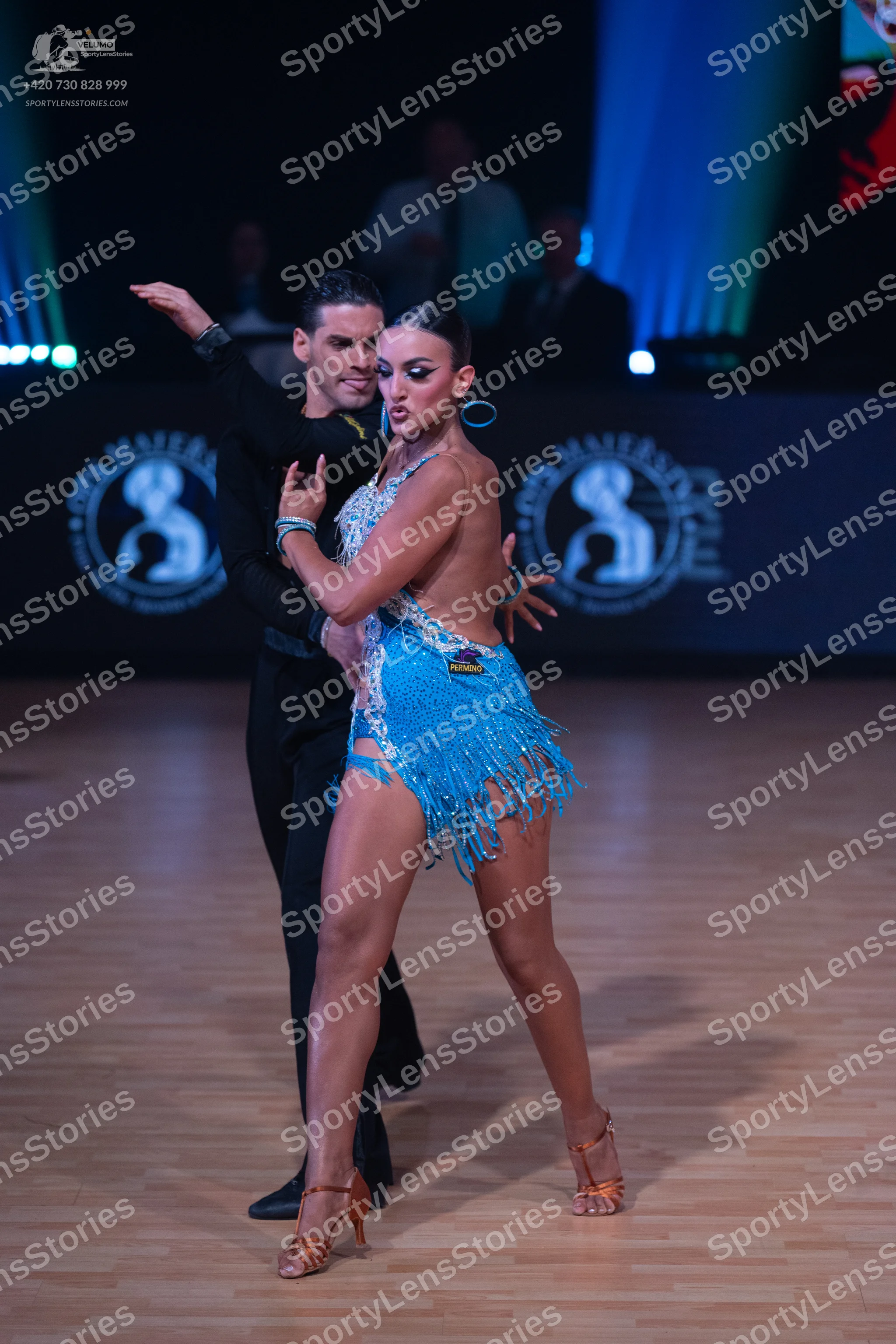Dancesport competitor: Male dancer: black long-sleeved top and black trousers