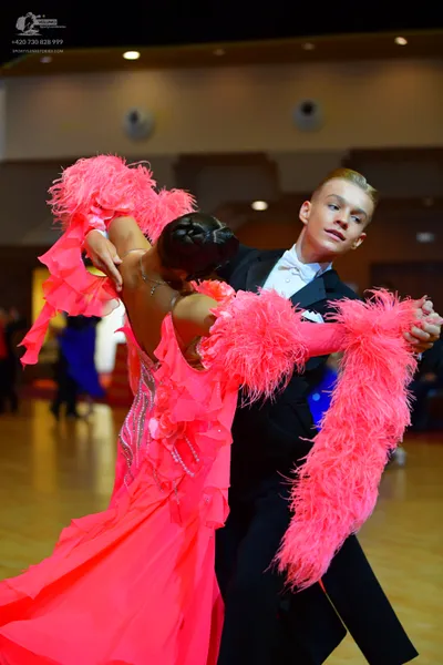 Dancesport competitor: Male dancer: black suit with a white shirt