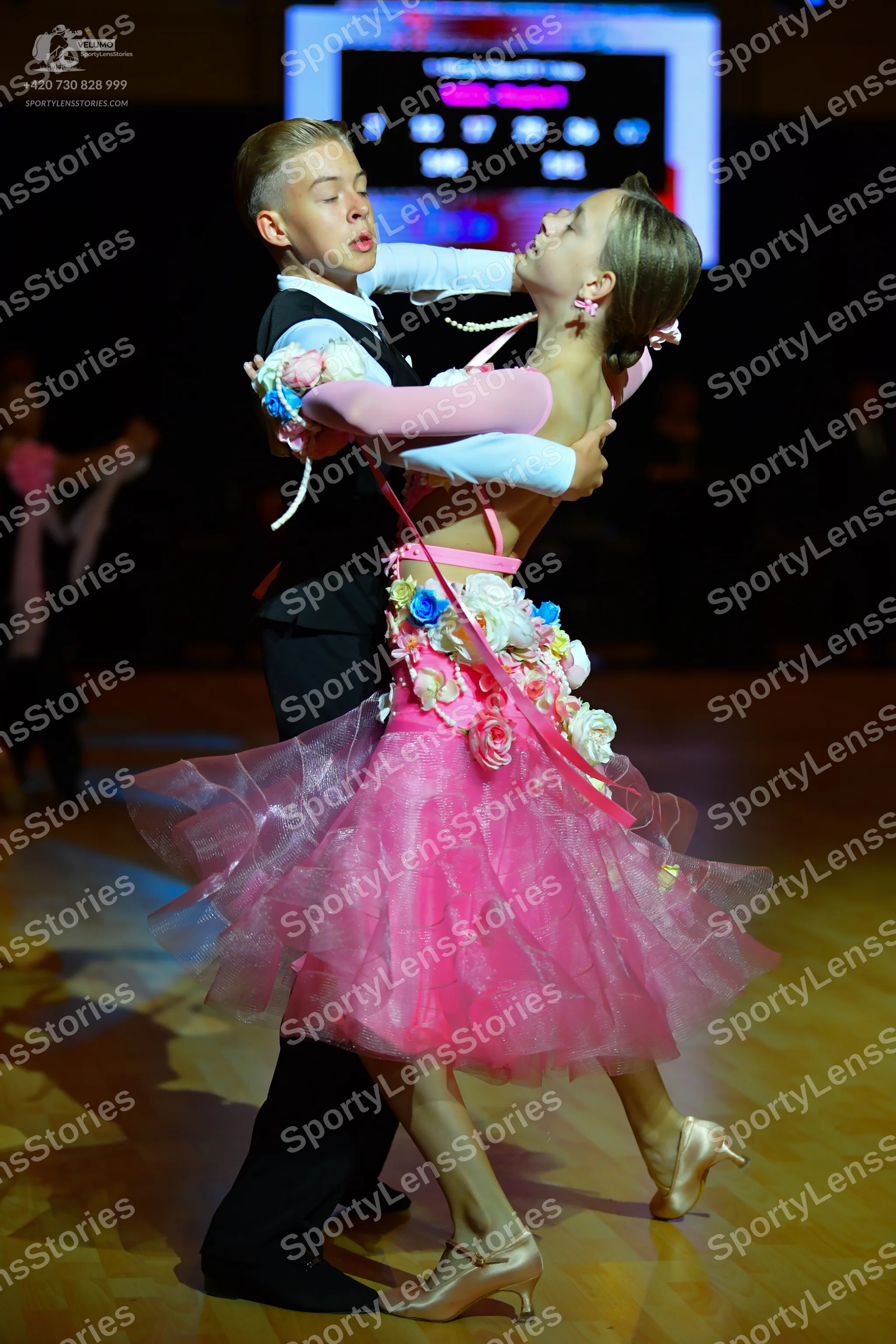 Dancesport competitor: Male dancer: black waistcoat, white long-sleeved shirt, and black trousers