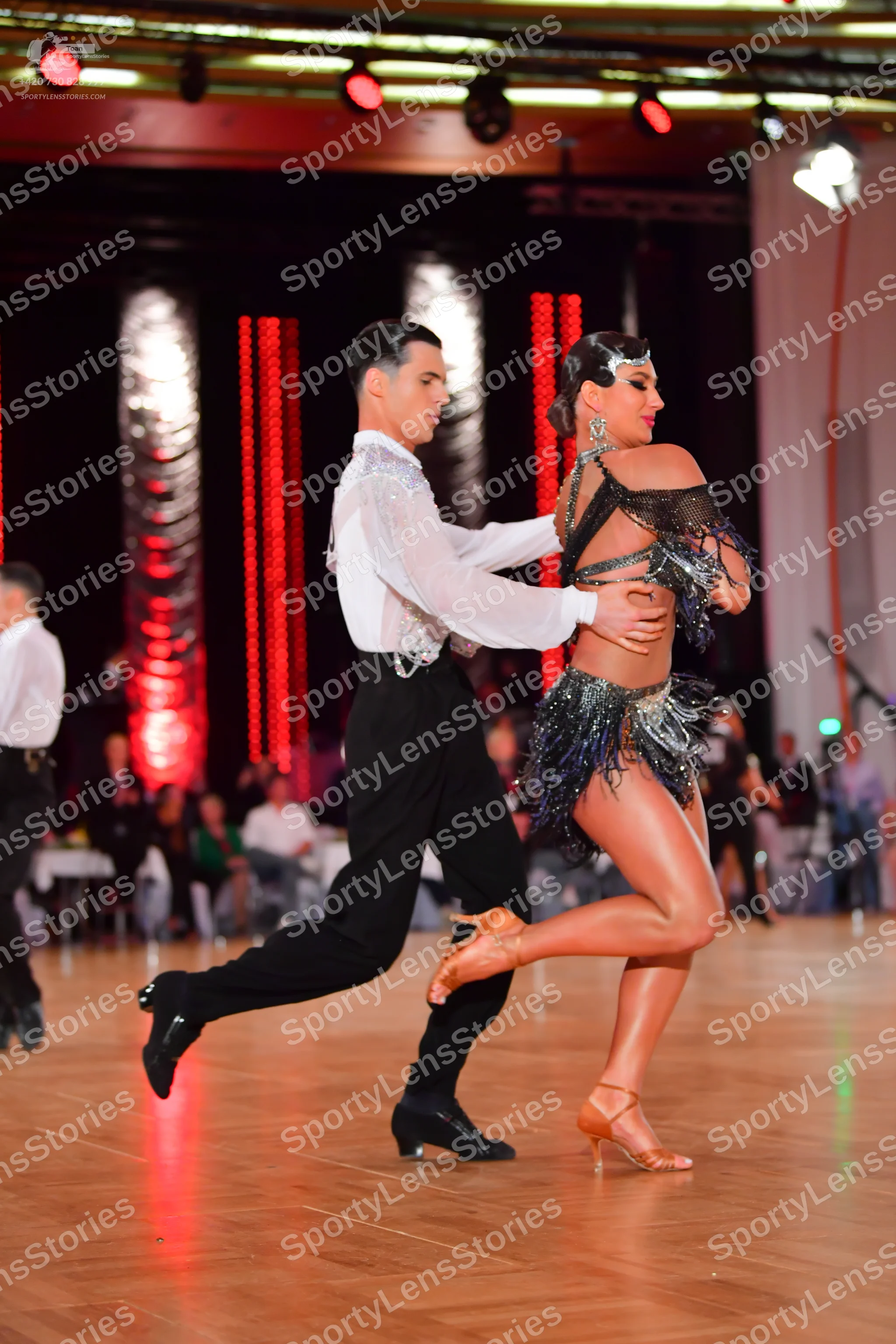 Dancesport competitor: Male dancer: white long-sleeved shirt with silver/white sequin embellishments on