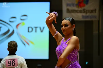 Dancesport competitor #98: Female dancer: purple latin dress with sequins and cutouts