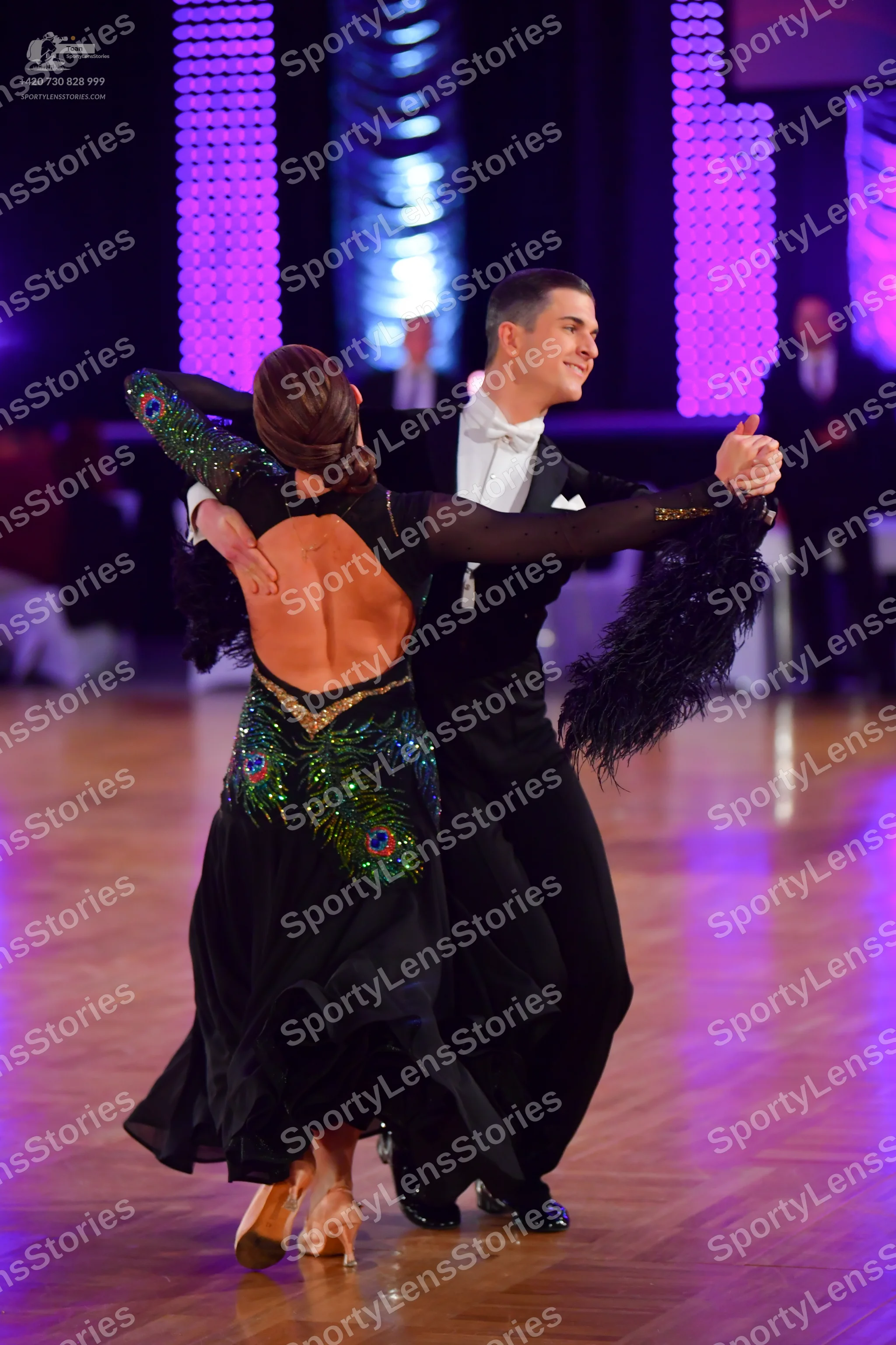 Dancesport competitor: Male dancer: black suit with a white shirt and white bowtie