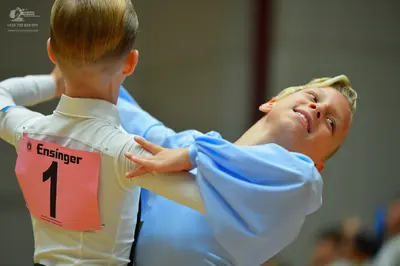 Dancesport competitor: Male dancer: white long-sleeved top